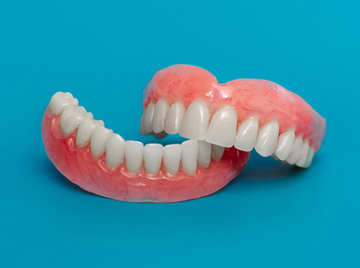 Tips to Get Used to Wearing New Dentures in Farmington